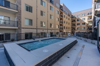 A small pool in the courtyard of apartment buildings.